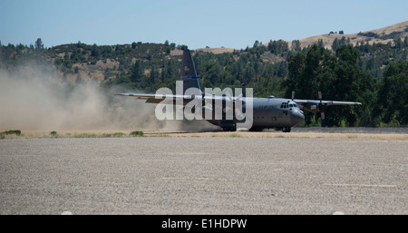 A U.S. Air Force C-130 Hercules aircraft lands at Fort Hunter Liggett, Calif., June 13, 2012, carrying equipment for exercise G Stock Photo