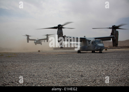 U.S. Marine Corps MV-22B Osprey aircraft attached to Marine Medium Tiltrotor Squadron (VMM) 365 lift off from Forward Operating Stock Photo