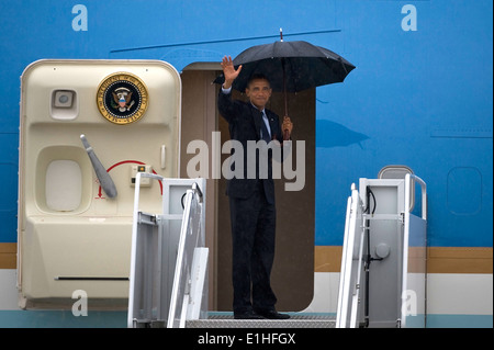 President Barack Obama waves before boarding Air Force One Aug. 22, 2012, at Nellis Air Force Base, Nev. The president visited Stock Photo