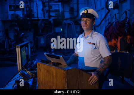 Petty Officer 3rd Class Patrick Humphrey, a crew member aboard the 270-foot Coast Guard Cutter Escanaba, stands watch on the qu Stock Photo