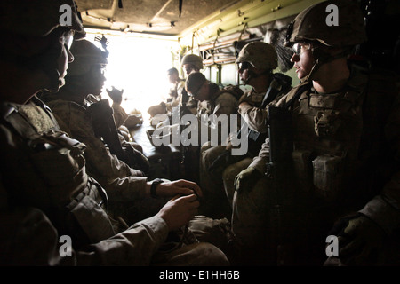 U. S. Marines with Company K, Battalion Landing Team 3rd Battalion, 2nd Marine Regiment, 26th Marine Expeditionary Unit, sit in Stock Photo