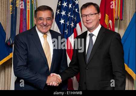 Secretary of Defense Leon E. Panetta, left, poses for a photo with Austrian Minister of National Defense Norbert Darabos at the Stock Photo