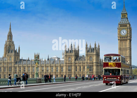 Red double-decker sightseeing bus travelling on Westminster Bridge with Big Ben or Elizabeth Tower, the Palace of Westminster or