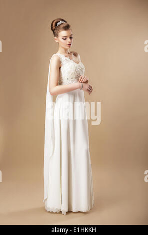Simplicity. Stylish Woman in Sleeveless Dress Stock Photo