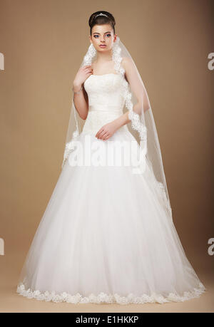 Wedding. Beautiful Graceful Bride in White Long Dress and Viel Stock Photo