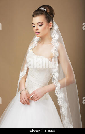 Young Romantic Newlywed with White Veil in Reverie Stock Photo