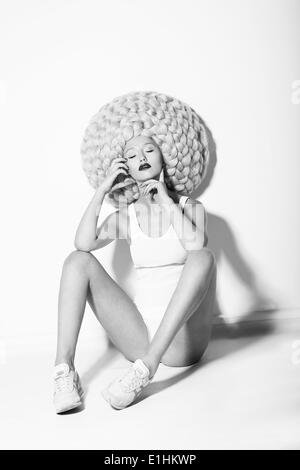 Art. Quaint Fancy Fashion Model sitting in Glamorous High Peruke Stock Photo
