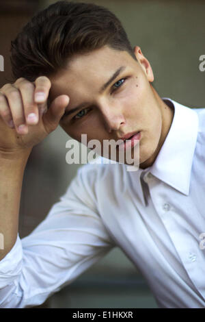 Portrait of Daydreaming Handsome Man Fashion Model in Reverie Stock Photo