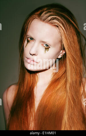 Bodyart. Face of Fanciful Red Hair Woman with Creative Stagy Art Make-up Stock Photo