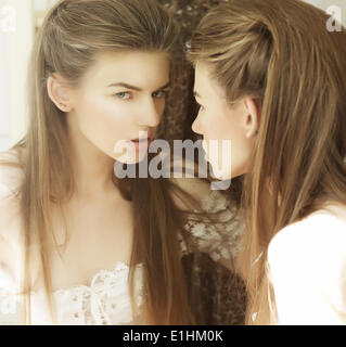 Delusion. Image of Beautiful Woman in Front of a Mirror Stock Photo