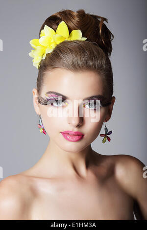 Eccentric Showy Woman with Vivid Colorful Makeup and False Long Eyelashes Stock Photo