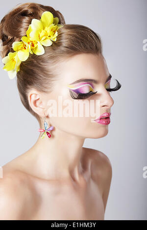 Glam. Profile of Fashionable Woman with Amazing Fantastic Eye Make-up Stock Photo