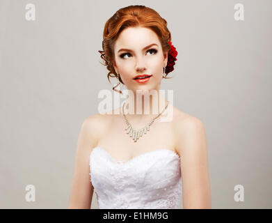 Sentimentality. Romantic Red Hair Woman with Flower in her Head. Femininity Stock Photo