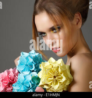 Beautiful Bright Woman holding Bouquet of Paper Origami Flowers Stock Photo