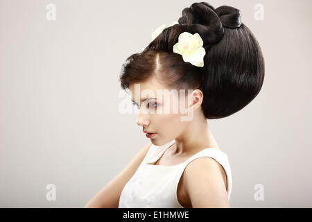 Vogue Style. Classy Charismatic Woman with Trendy Luxurious Hairstyle. Allure Stock Photo