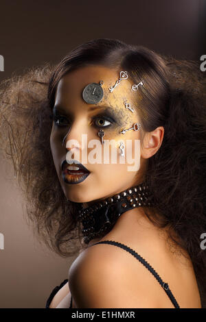 Futurism. Bodyart. Golden Painted Woman's Skin with Silver Accessory. Art Deco Stock Photo