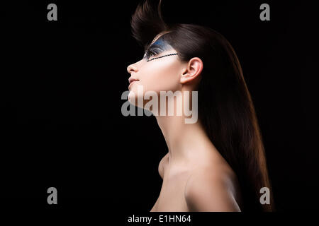 Glitter. Profile of Brown Hair Woman with Blue Eye Shadows and Strass on her Face Stock Photo