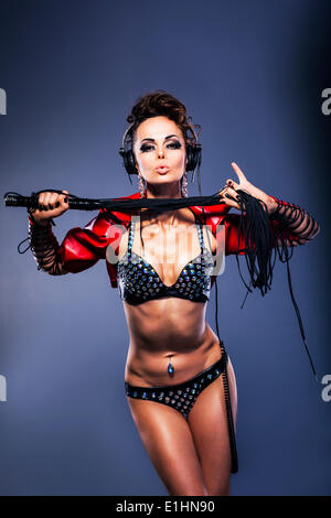 Sexy fetish woman dj in lingerie holding whip with headphones listening to the music Stock Photo - Alamy Sexy fetish woman dj in lingerie holding whip with headphones listening to the music Stock Photo - Alamy