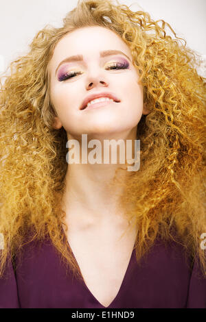 Youth. Beauty Portrait Of Frizzy Red Hair Woman closeup. Pretty Smile