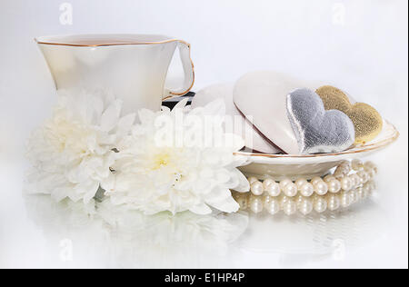 Saint valentines day - pearls, symbols of hearts and white flowers on white background - series of photos Stock Photo