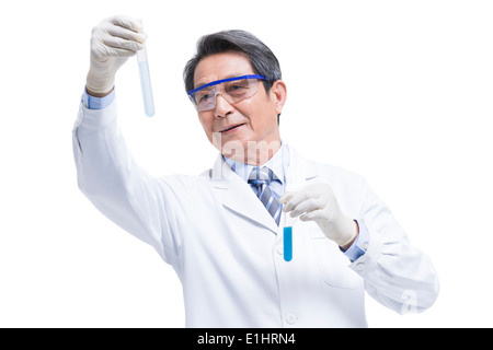 Senior scientist doing experiments Stock Photo