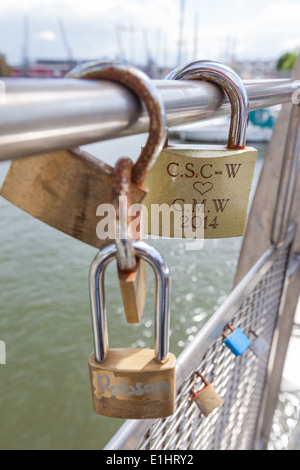 BRISTOL, UK - JUNE 3, 2014 : Close-up of Padocks symbolising everlasting love attached by romantic couples to Pero's Bridge. Stock Photo