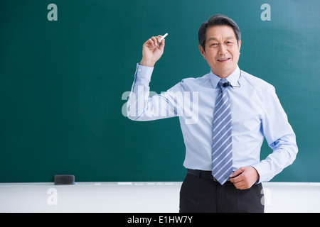 Professor teaching in classroom Stock Photo