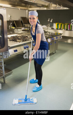 Woman cleaning the kitchen Stock Photo