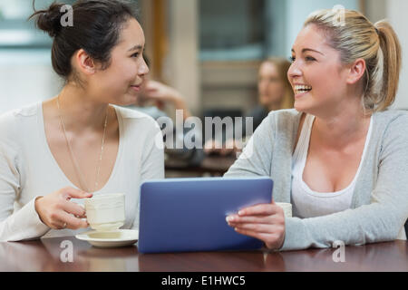 Two students chatting in a coffee shop Stock Photo