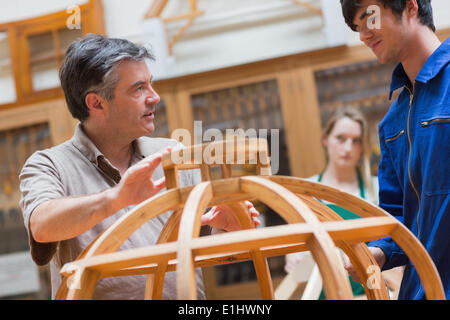 Explaining teacher in a woodwork class Stock Photo