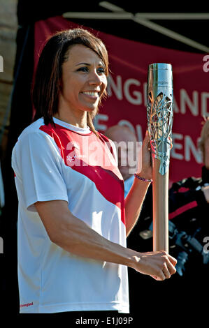 Tonbridge, Kent, UK. 5th June, 2014. . 05th June, 2014. Kent athlete and Olympic Gold medal winner Dame Kelly Holmes holds the Commonwealth Games Queen's Baton after it's arrival at Tonbridge Castle. The event was attended by children from local schools who participated in a variety of activities organised by Tonbridge and Malling Council. Credit:  patrick nairne/Alamy Live News Stock Photo
