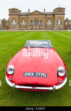 Vintage E-type Jaguar parked on lawn at Holkham Hall in Norfolk Stock Photo
