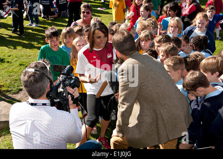 Tonbridge, Kent, UK. 5th June, 2014. . 05th June, 2014. Olympic Gold medal winner and Kent athlete Dame Kelly Holmes is interviewed following the arrival of the Commonwealth Games Queen's Baton in the town. The event was attended by children from local schools who participated in a variety of activities organised by Tonbridge and Malling Council. Credit:  patrick nairne/Alamy Live News Stock Photo