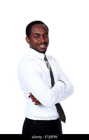 Happy african businessman with arms folded over white background Stock Photo