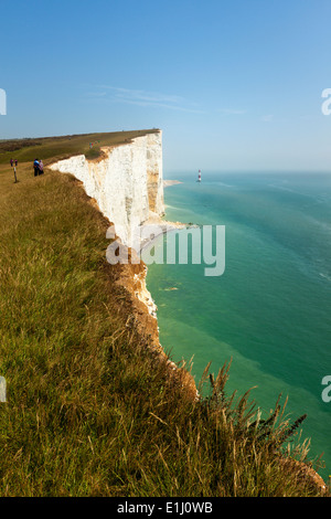 Tourists on the edge of Beachy Head cliff on the Channel coast, East Sussex, UK Stock Photo
