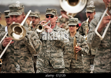 The U.S. Air Force Band of Mid-America marches outside as Marine Corps veteran Reggie Geggie, not pictured, guest of honor and Stock Photo