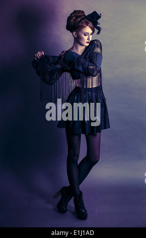 Woman wearing black clothes and little 