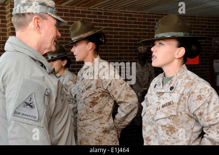 U.S. Army Gen. Martin E. Dempsey, left, the chairman of the Joint Chiefs of Staff, talks with U.S. Marine Corps Staff Sgt. Meli Stock Photo