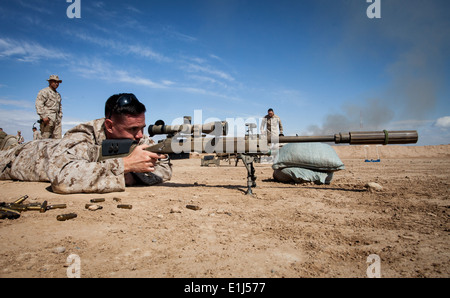 U.S. Marine Corps 1st Lt. Nathan M. Brown, with Regimental Combat Team 7, engages a target at a live-fire range at Camp Leather Stock Photo