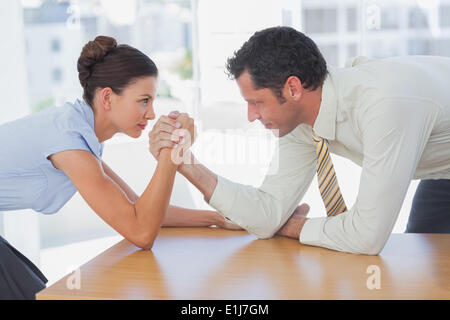 Business people arm wrestling Stock Photo