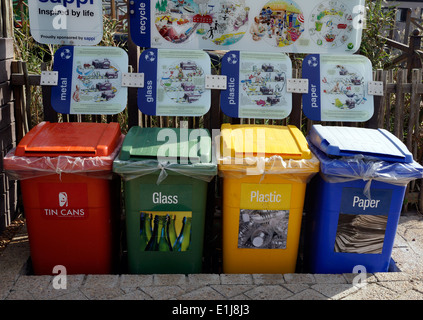 Brightly coloured recycling wheelie bins at Intaka Island bird sanctuary near Cape Town. Stock Photo
