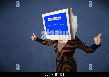 Person with a monitor head and fatal error blue screen on the display Stock Photo