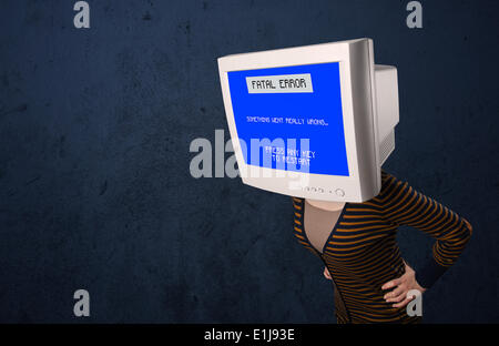 Person with a monitor head and fatal error blue screen on the display Stock Photo