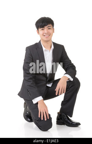 young business man standing a funny pose with white background Stock Photo