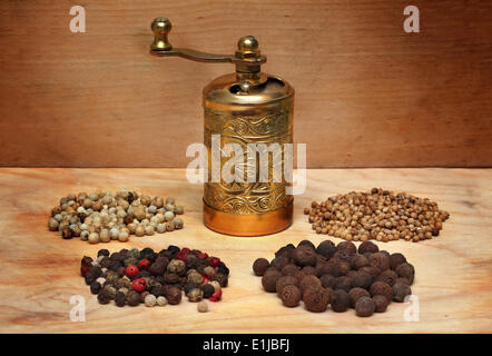 Vintage manual spice grinder on wooden background Stock Photo - Alamy