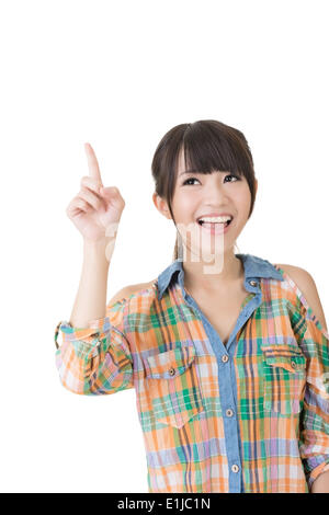 Young pretty asian woman pointing up Stock Photo