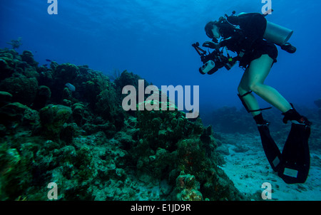 U. S. Navy Petty Officer 2nd Class Kathleen Gorby conducts underwater photography training off the coast of Guantanamo Bay, Cub Stock Photo