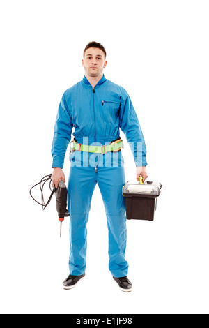 Studio portrait of worker holding a drill and a tools box, isolated over white background Stock Photo