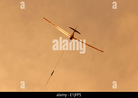 ASK13 glider of the Crusaders Gliding Club, Cyprus, launches into the sunset from Kingsfield airstrip, Dhekelia, Cyprus. Stock Photo