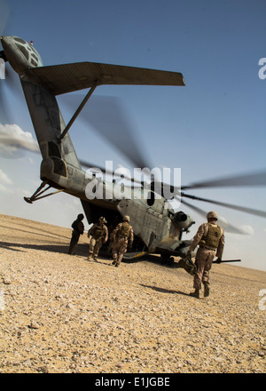 U.S. Marines and Sailors assigned to the 26th Marine Expeditionary Unit prepare to depart Al Galail, Qatar, in a Marine Corps C Stock Photo